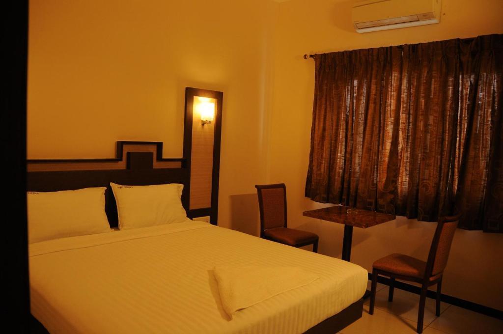 Hotel Viswas Tiruppur Pokoj fotografie